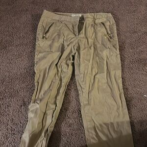 Michael Kors ; not actual pockets in the back; zipper pockets in the front